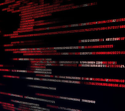 Des colonnes de chiffres rouges défilent sur un écran de code sombre